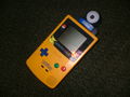 The Game Boy Camera (blue model) inserted into a Game Boy Color