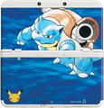 A white New Nintendo 3DS with cover plates featuring Blastoise.