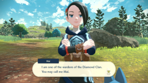 Mai, wearing a blue hoodie and short black hair, introducing herself to the player