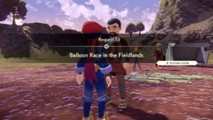 A man in an orange outfit labeled "Balloon Race" at the Heights Camp.